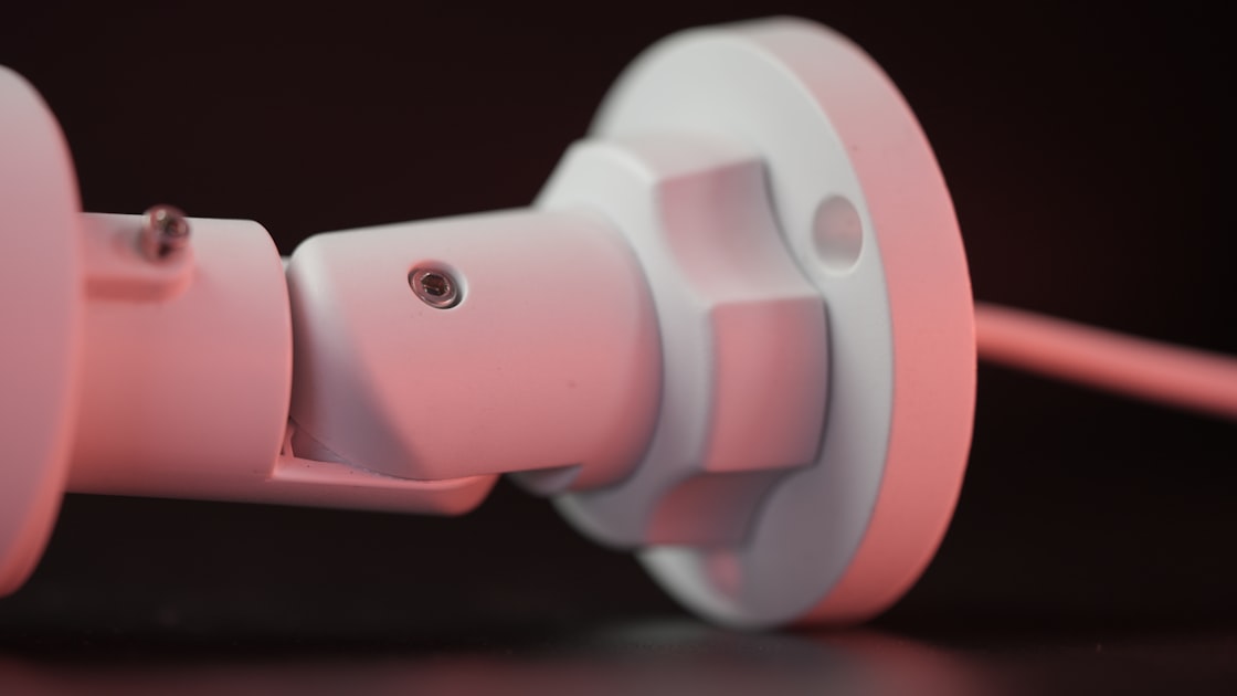 a close up of a pink object on a table