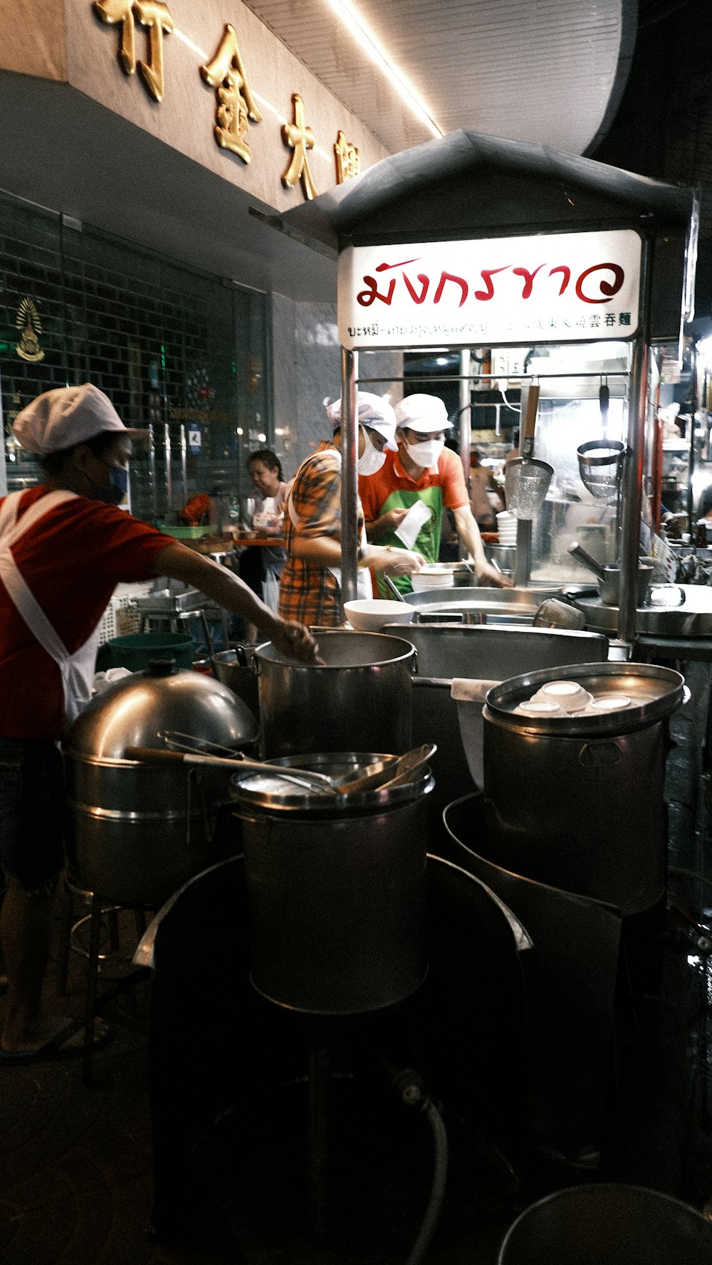 a group of people in a kitchen preparing food