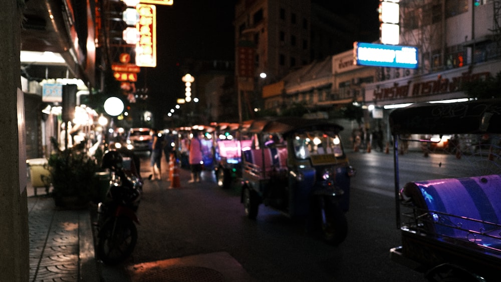 a busy city street at night with lots of traffic