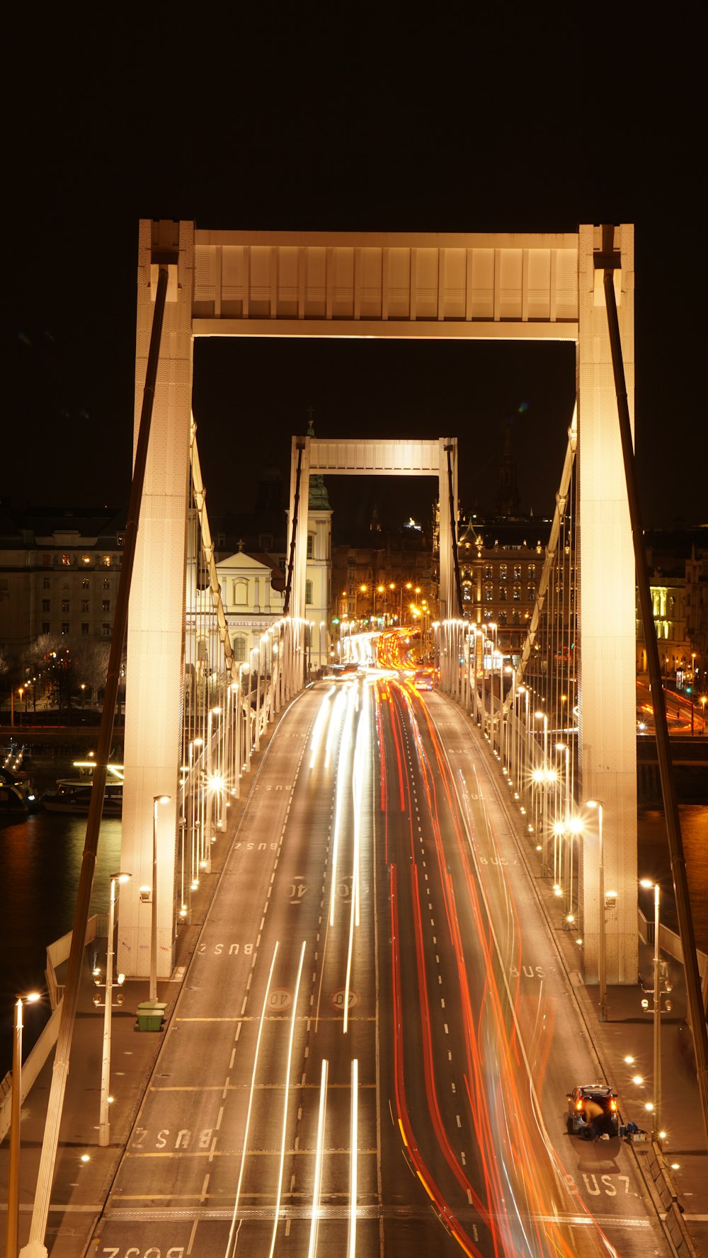 a long exposure shot of a bridge at night