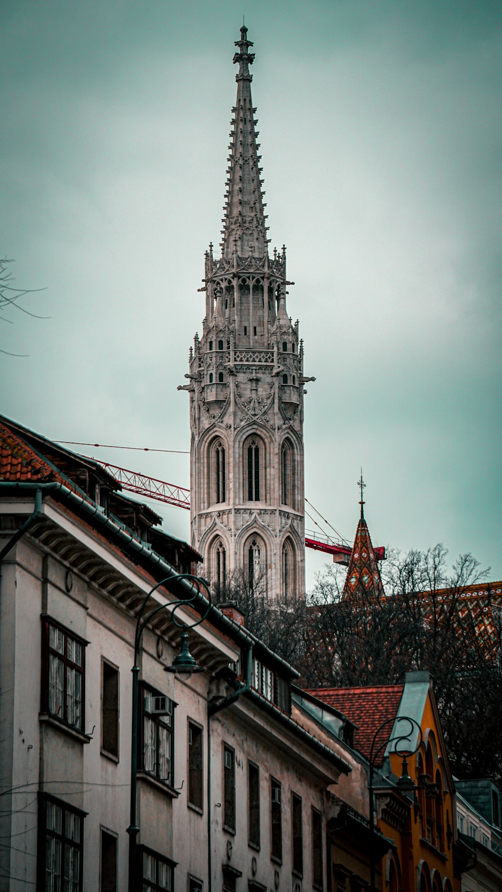 a very tall tower with a clock on it's side