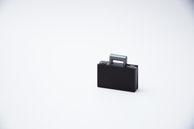A lineup of various suitcase styles and colors displayed on a white background.