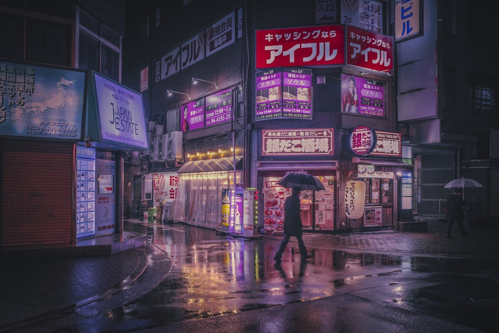 a person walking down a street holding an umbrella