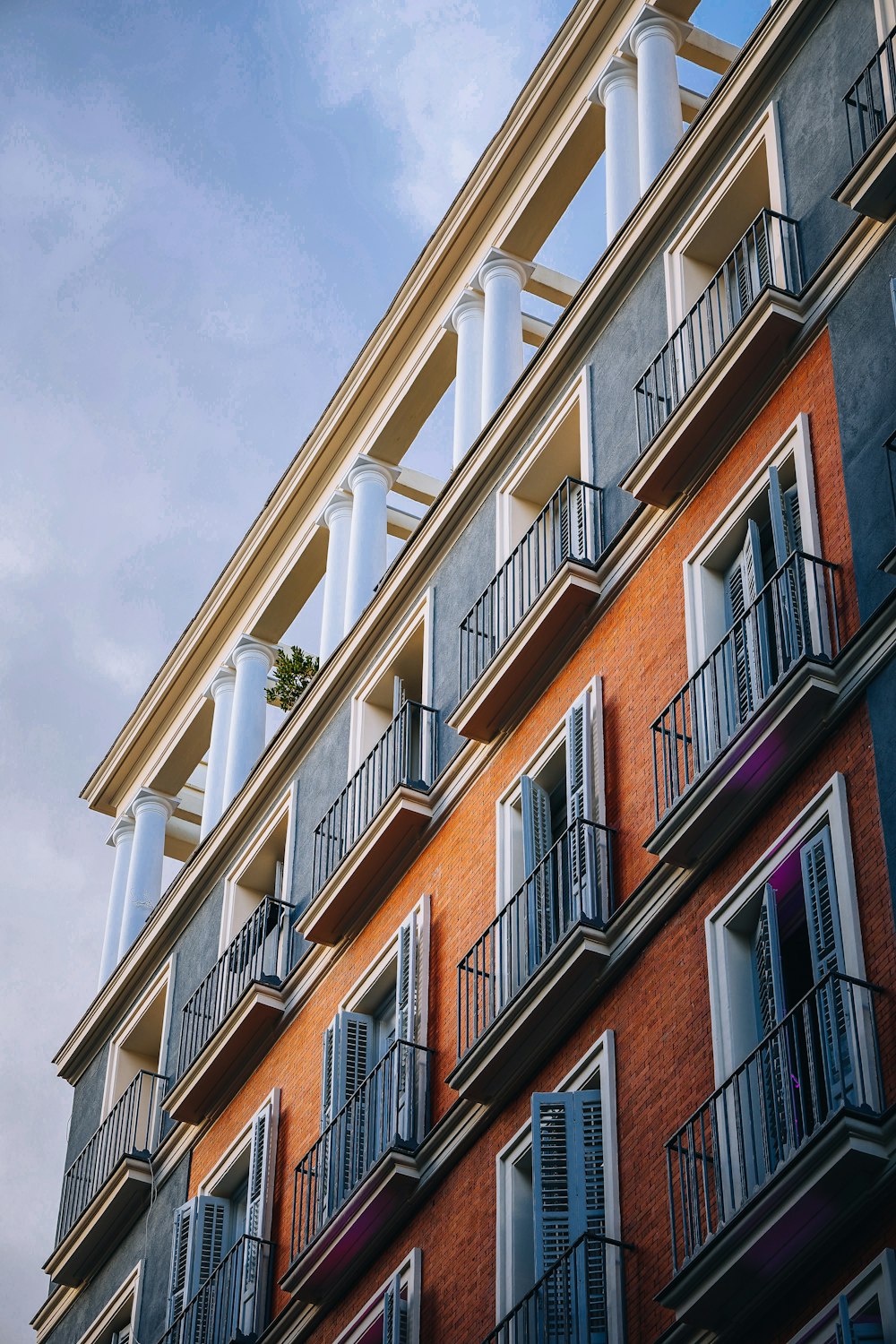 an apartment building with balconies and balconies on the balconies