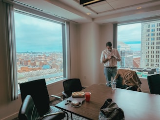 Jiles Smith II consulting with city officials in a conference room, reviewing risk management plans.