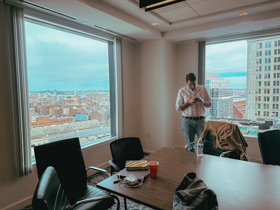 Jiles Smith II consulting with city officials in a conference room, reviewing risk management plans.