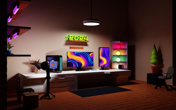 A modern home office setup features two large monitors with vibrant, abstract designs. The room is illuminated by soft, colorful lighting, and a neon sign displaying '2024' is mounted on the wall. There is a computer tower on the desk and shelves with various decorations, including a small plant and glowing orbs in a shelving unit. A chair and a potted plant are situated on the wooden floor.