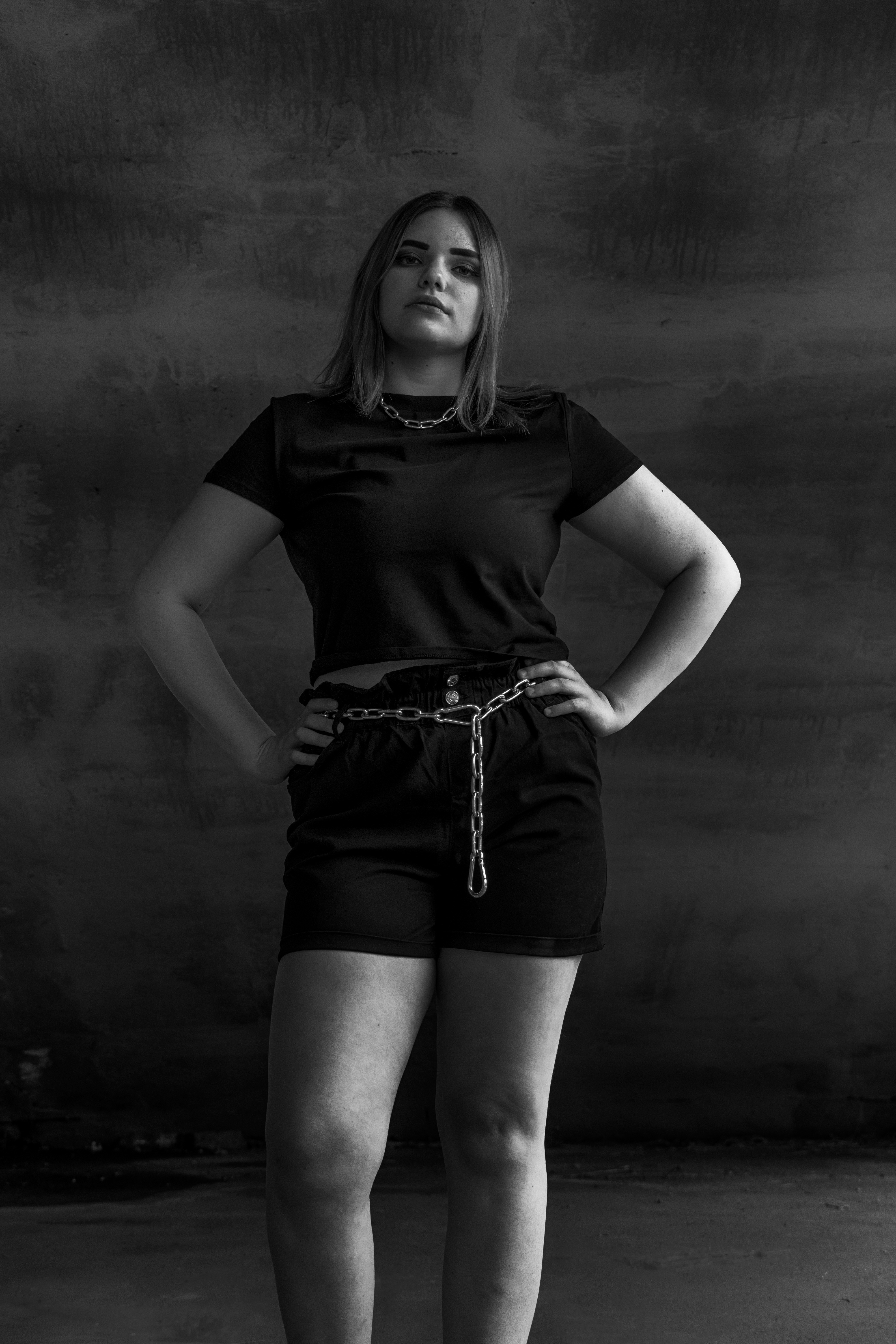 a woman standing with her hands on her hips