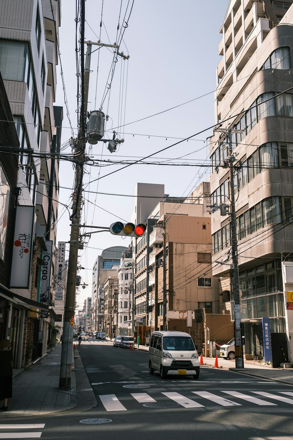 a car is driving down a city street