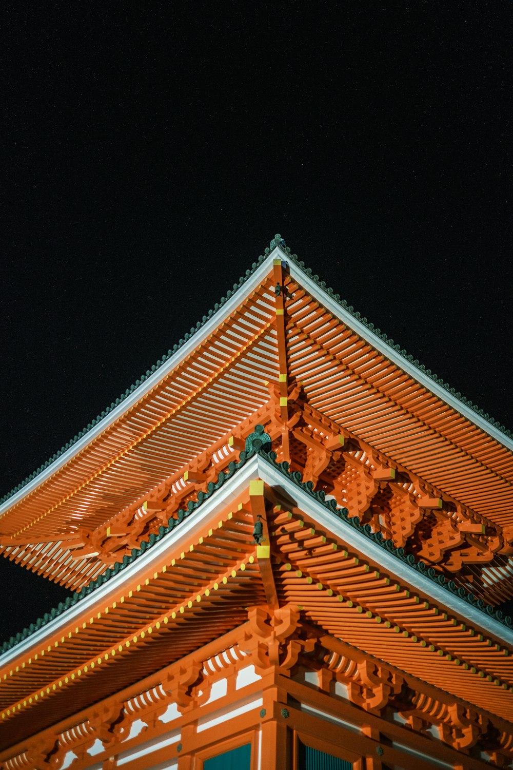 a tall wooden structure with a sky background