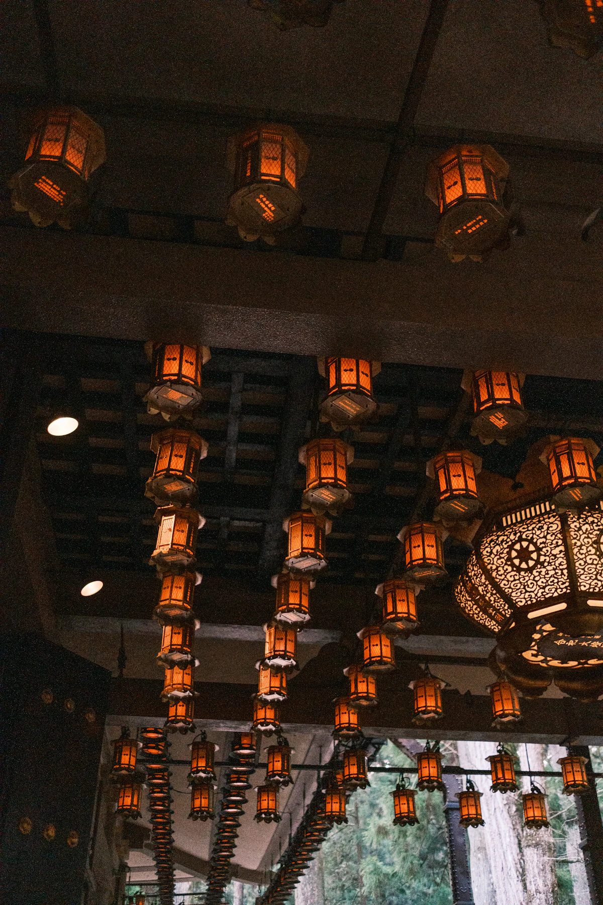 Rows of hanging lanterns inside a temple hall at Koyasan
