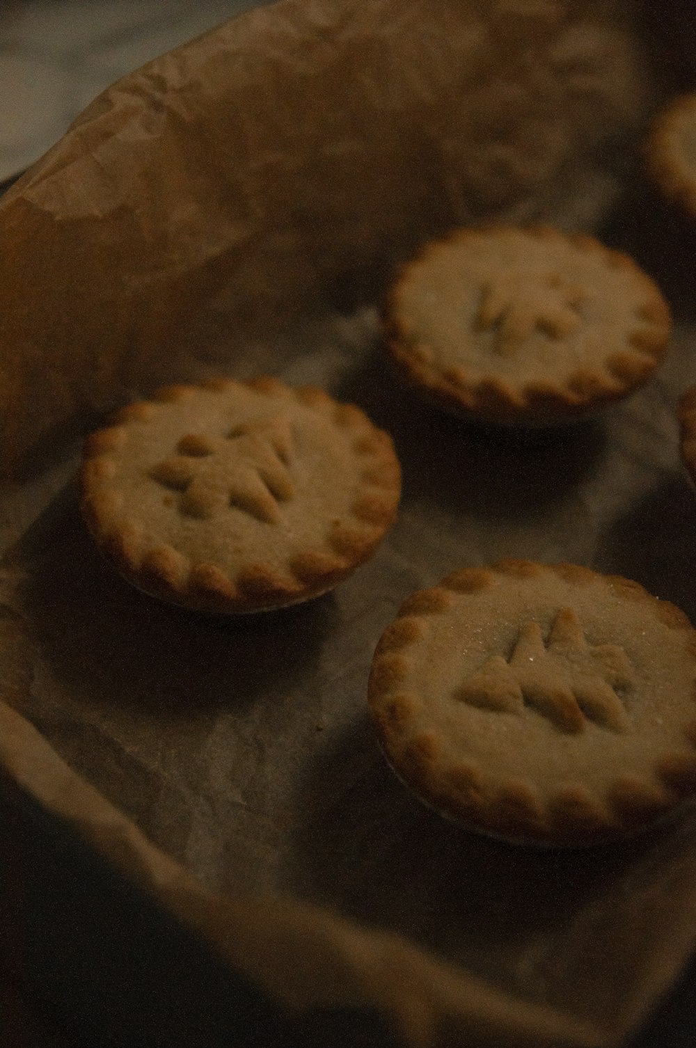 a group of small cookies sitting on top of a piece of wax paper