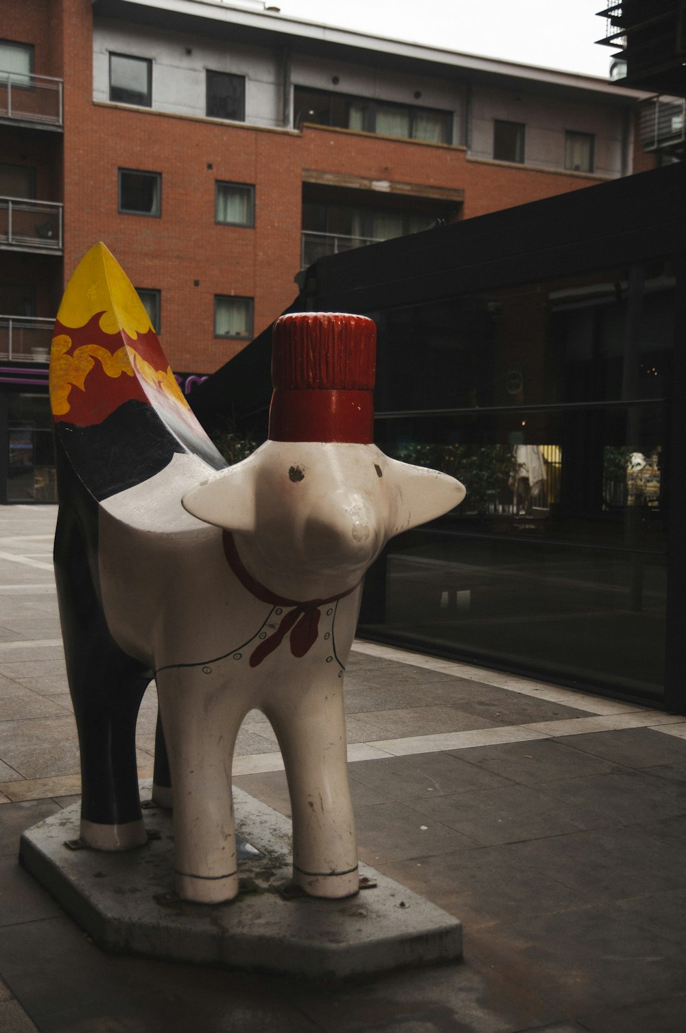 a statue of an elephant with a hat on its head