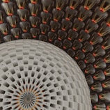 An intricate and symmetrical pattern featuring a large circular design in the foreground with a textured, woven appearance. The background is filled with repeated cone-shaped elements, each with a glossy surface and a red tip, creating a sense of depth and complexity.