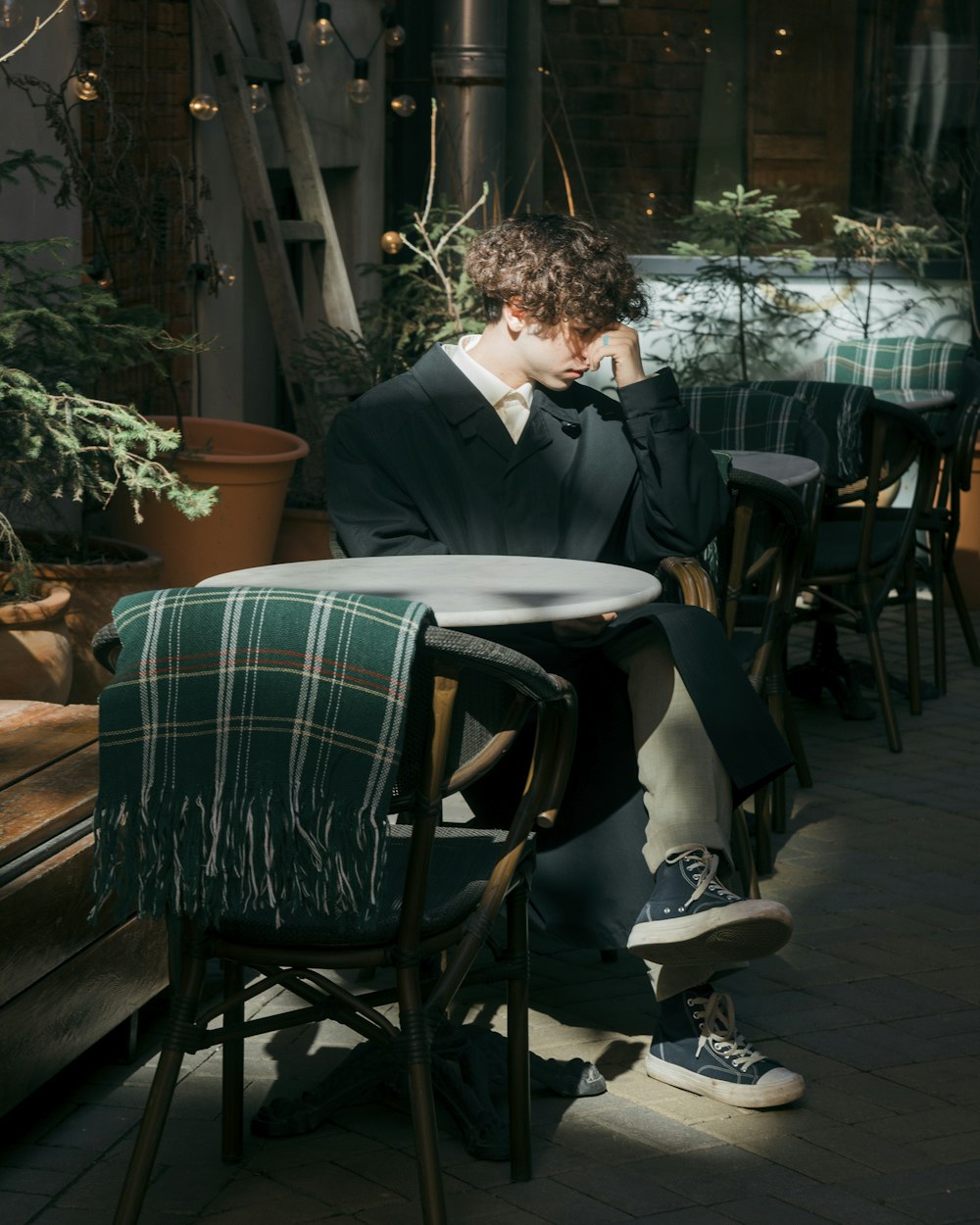 a man in a suit sitting at a table