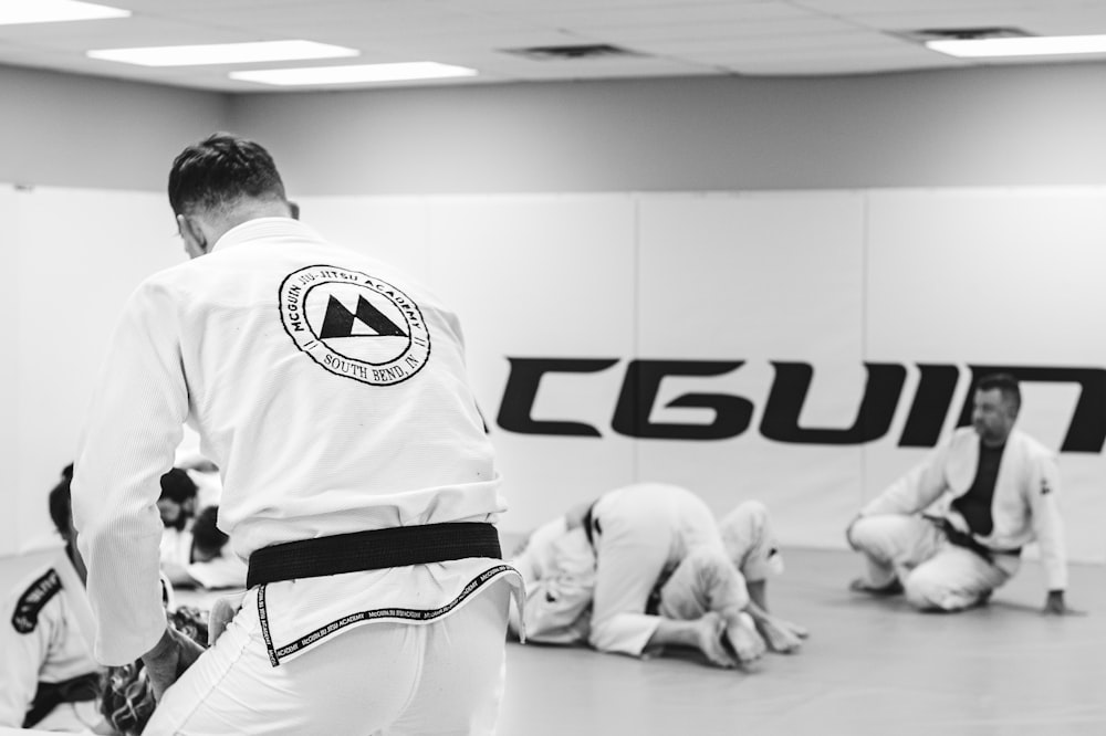 a group of people in a gym doing karate