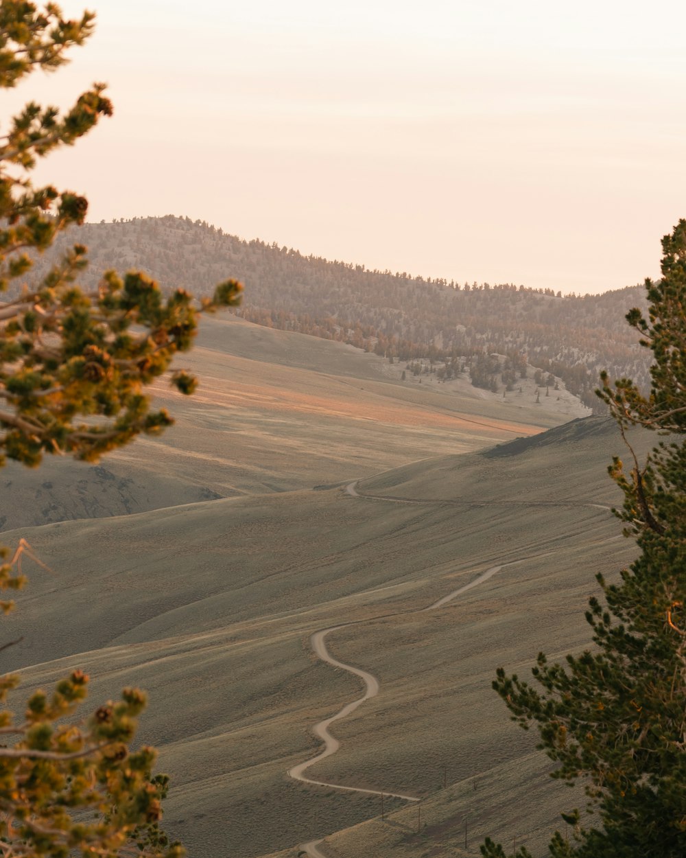 a view of a winding road in the mountains