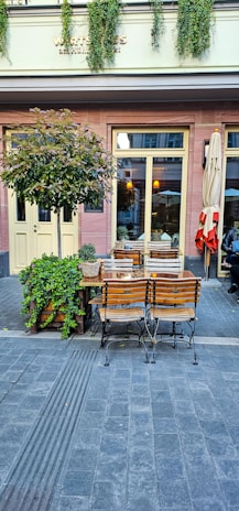 A quaint café terrace with warm lighting, inviting travelers to relax and enjoy a weekend break.