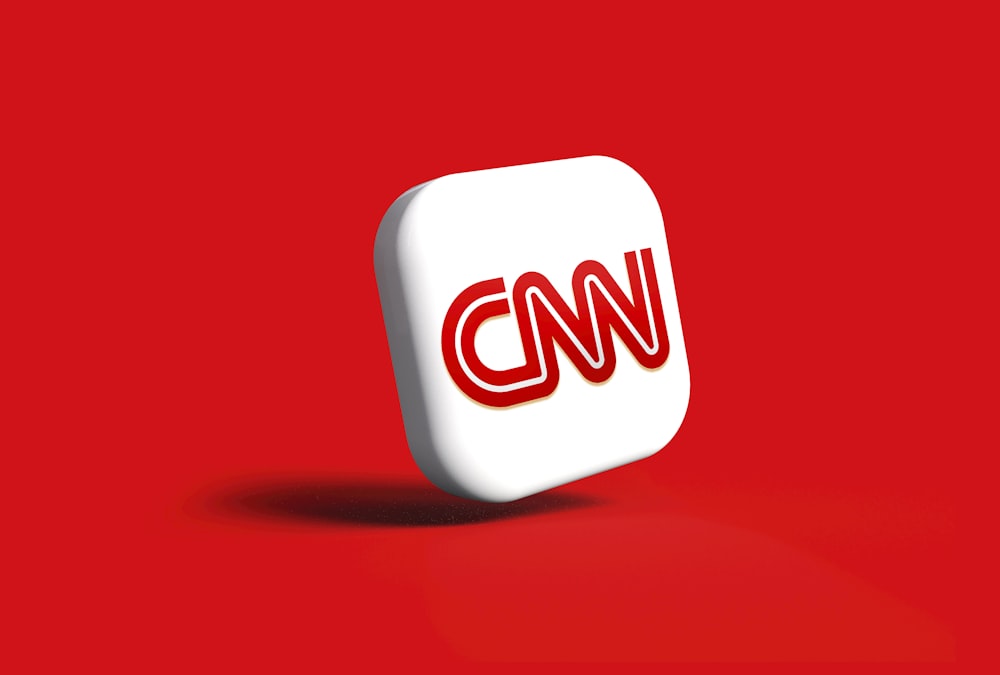 the cnn logo on a red background