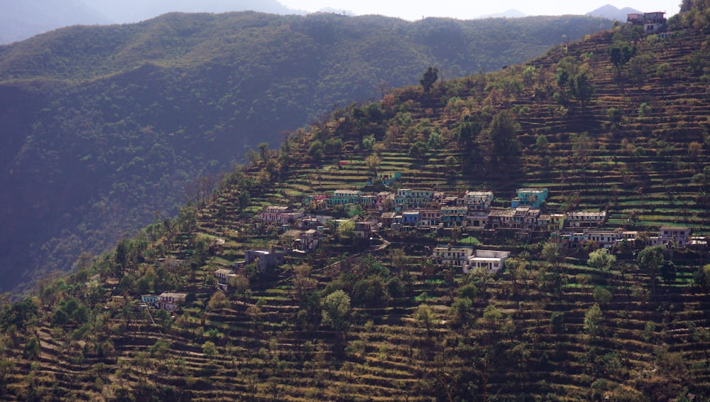 a view of a village on the side of a mountain