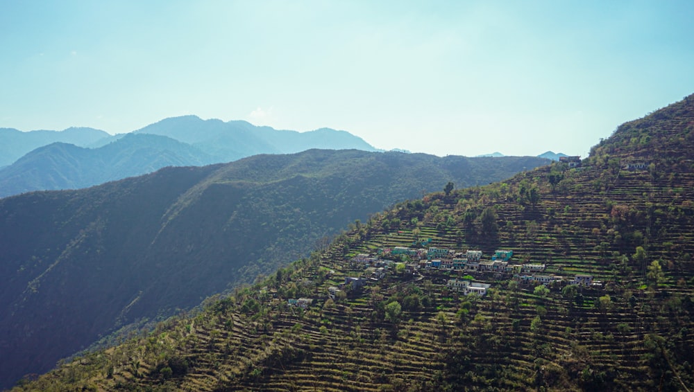 a view of a village on the side of a mountain