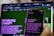 A hand holding a smartphone displaying an introduction screen for ChatGPT with the text visible. The background features a blurred computer screen showing similar content, creating a mirror effect. Both screens have a green and purple color scheme.