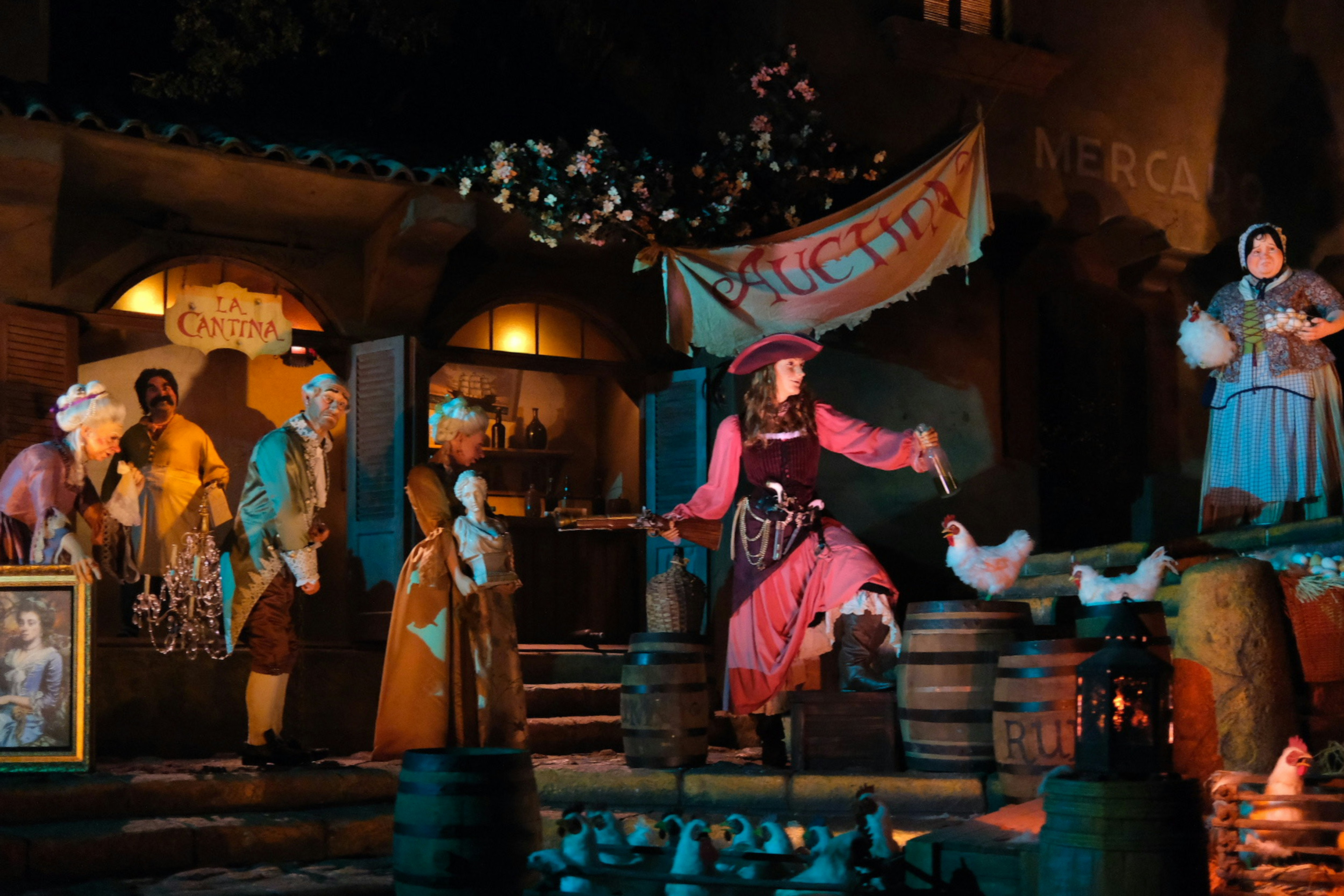 a group of people dressed in costumes on stage, Pirates of the Caribbean attraction at Disneyland in California