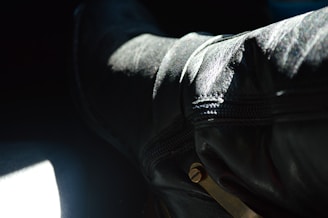 A stunning close-up of aviator-inspired boots showcasing intricate stitching and high-quality leather.