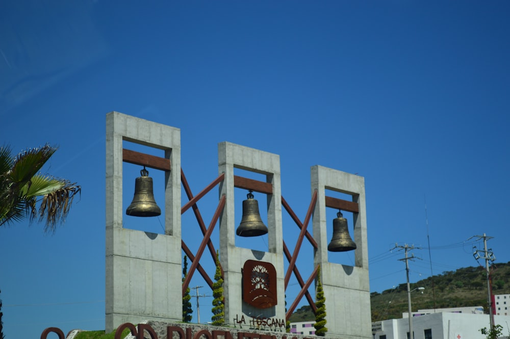 a large sign with bells on top of it
