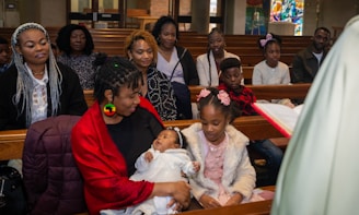 a group of people sitting in pews in a church