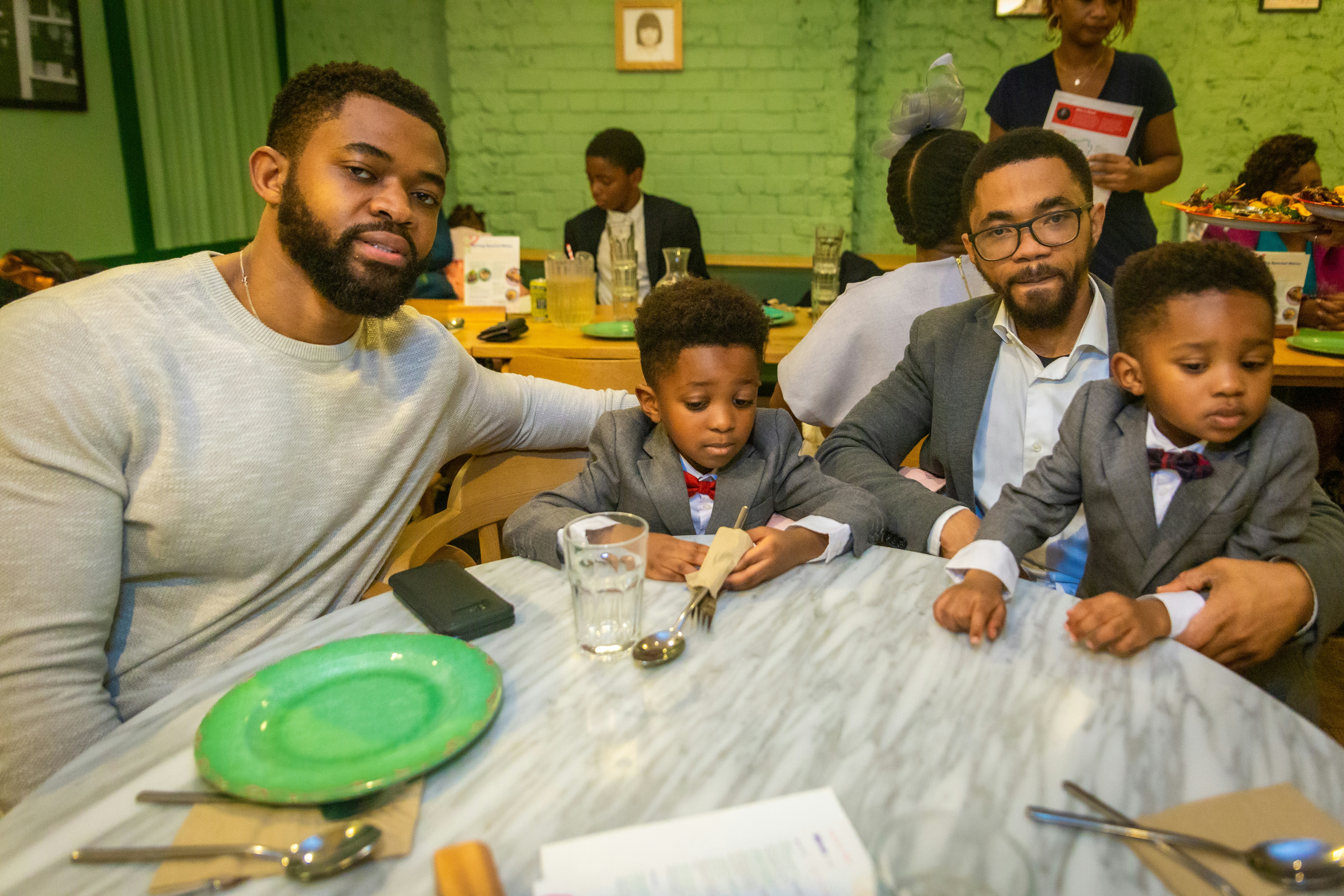 a group of people sitting around a table