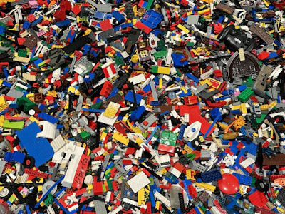 Volunteers sorting and sanitizing used LEGO bricks ready for donation.