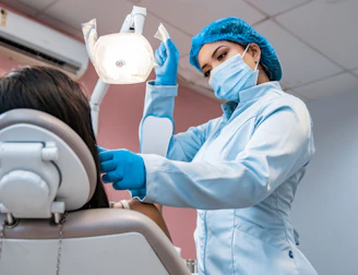 A patient receiving a comfortable dental filling in a calm, mint-themed room.