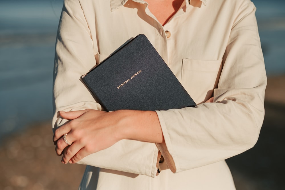 a woman holding a bible in her hands