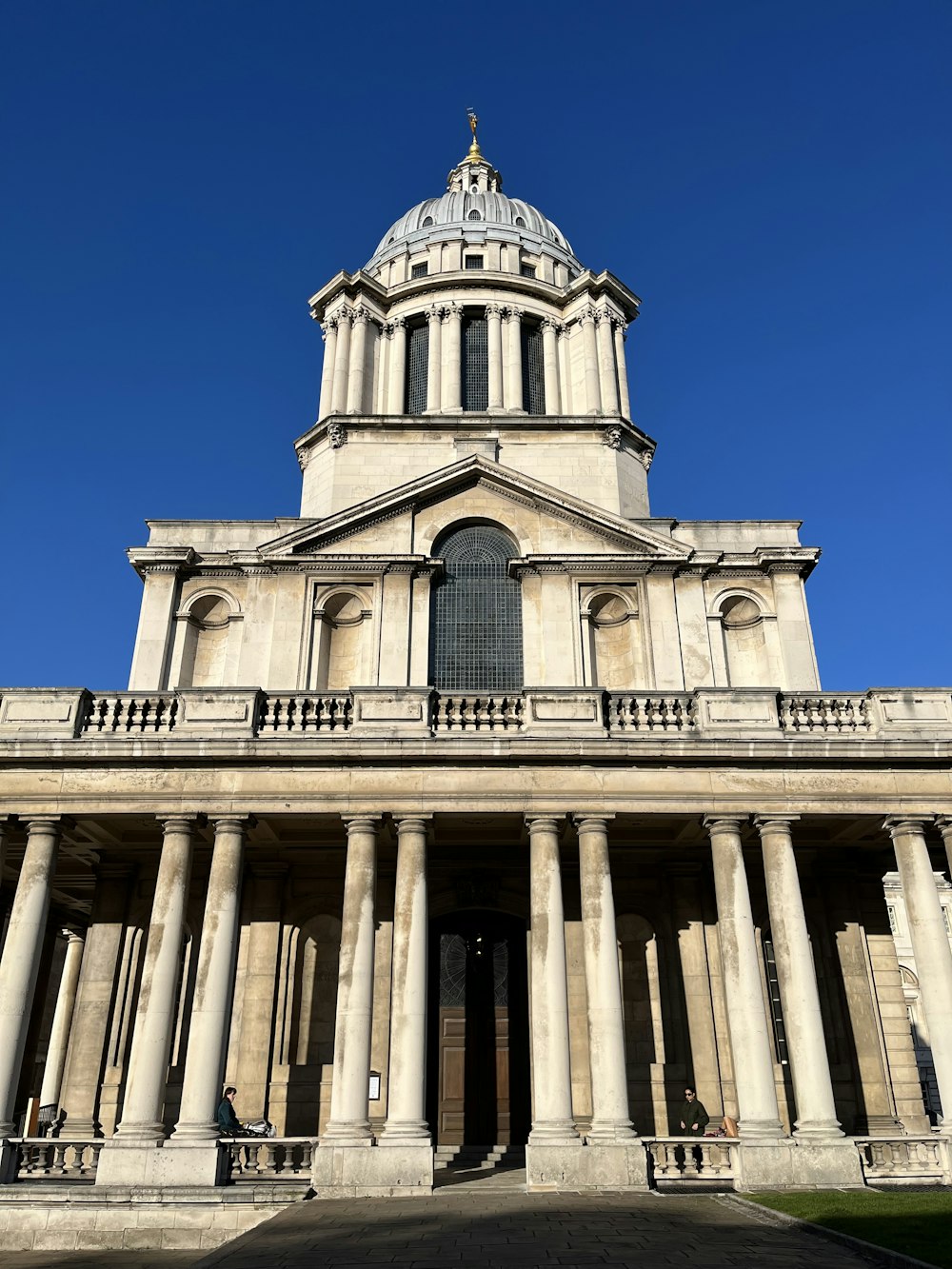 a large building with columns and a dome on top