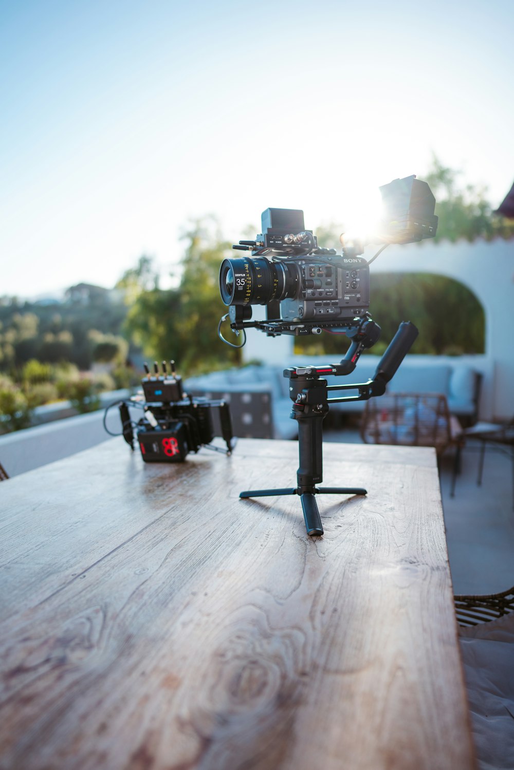 a camera set up on a wooden table