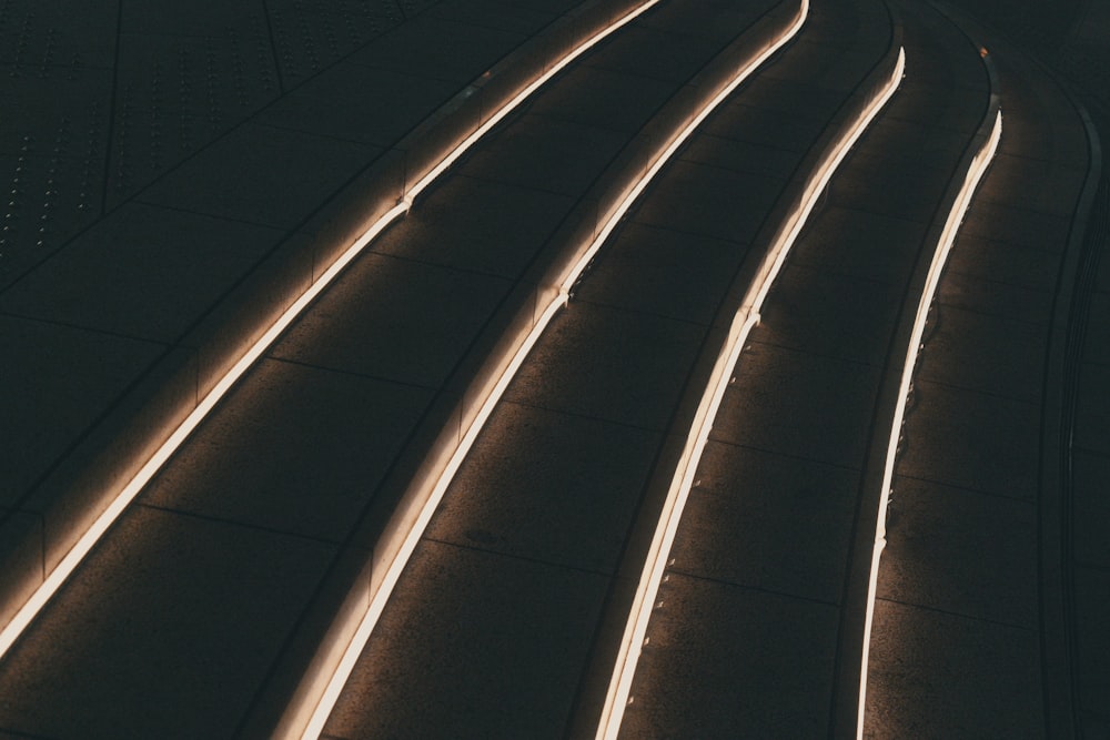 a train track with lights on at night