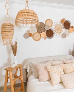 a bedroom with a bed and a wall decoration