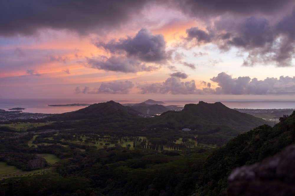 a sunset view of a lush green valley