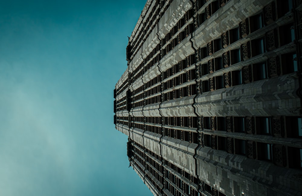 a very tall building with a sky in the background