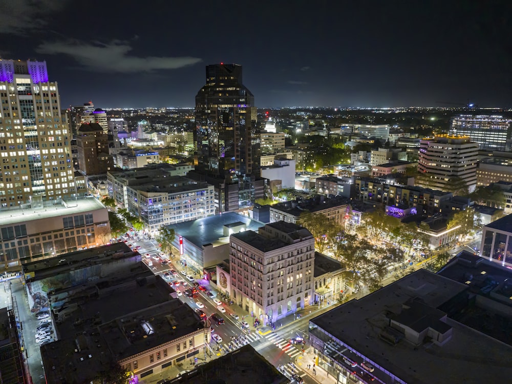 a view of a city at night from the top of a building