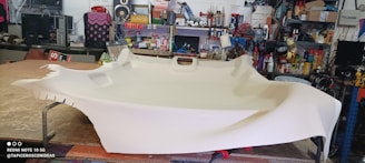 Tools and materials neatly arranged on a workbench ready for upholstery work.