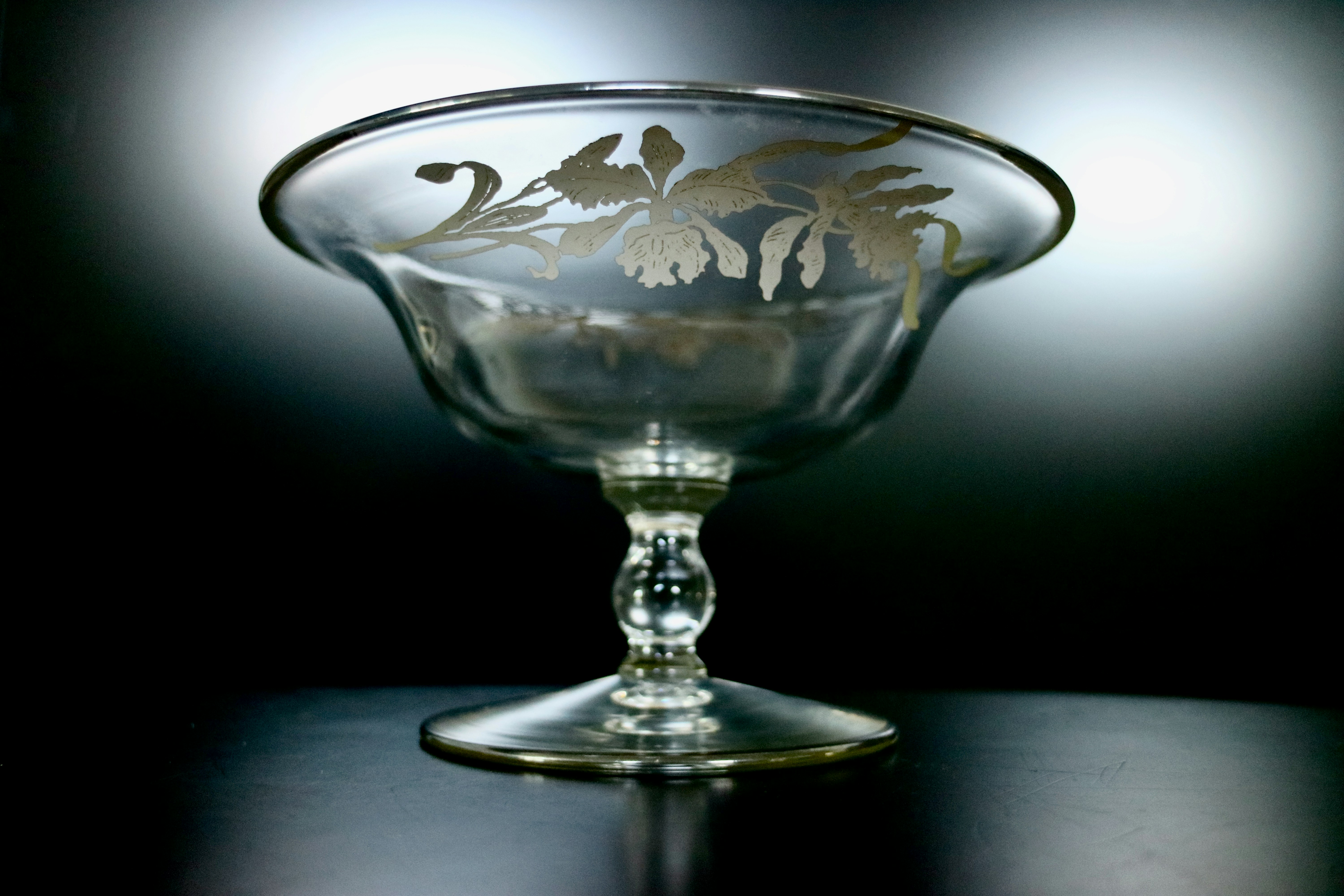 a glass bowl sitting on top of a table