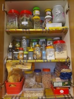 An organized pantry filled with jars of spices and ingredients.