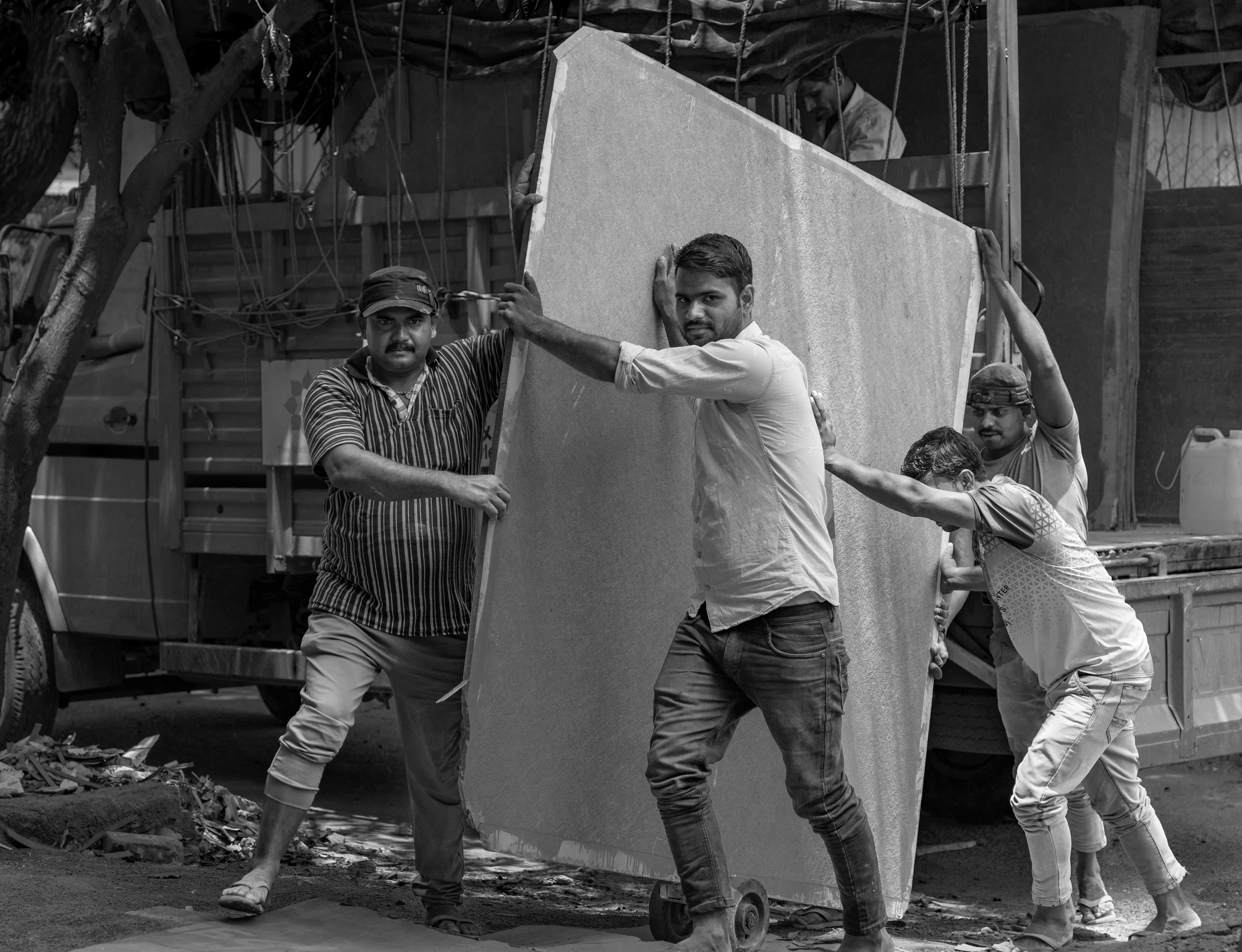 Construction site work in progress with material delivery and unloading