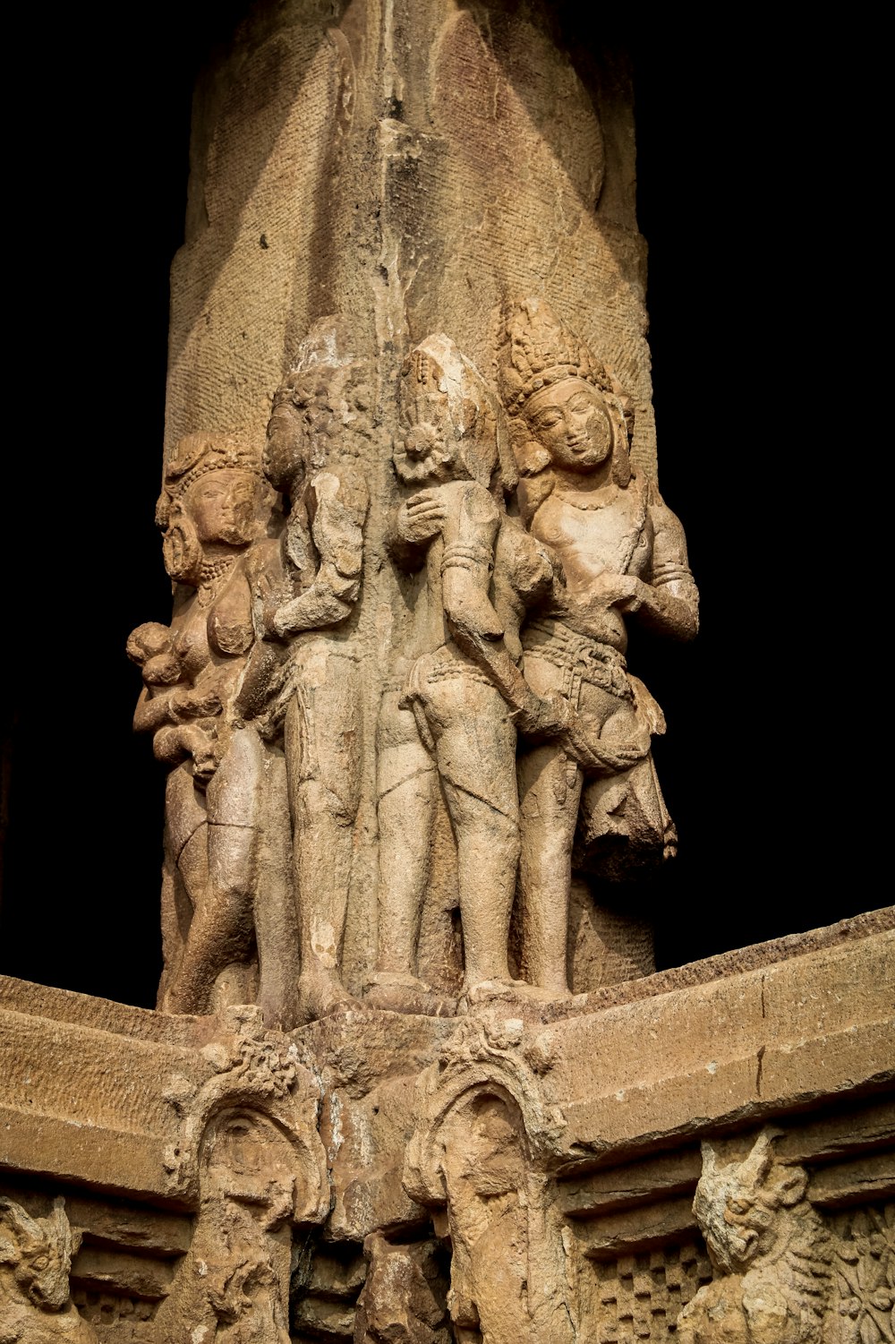 a statue of a group of people standing next to each other