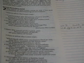 A close-up of hands holding an open Bible with highlighted verses and notes.