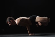 An advanced workout pose balancing on one leg, highlighting strength and focus.