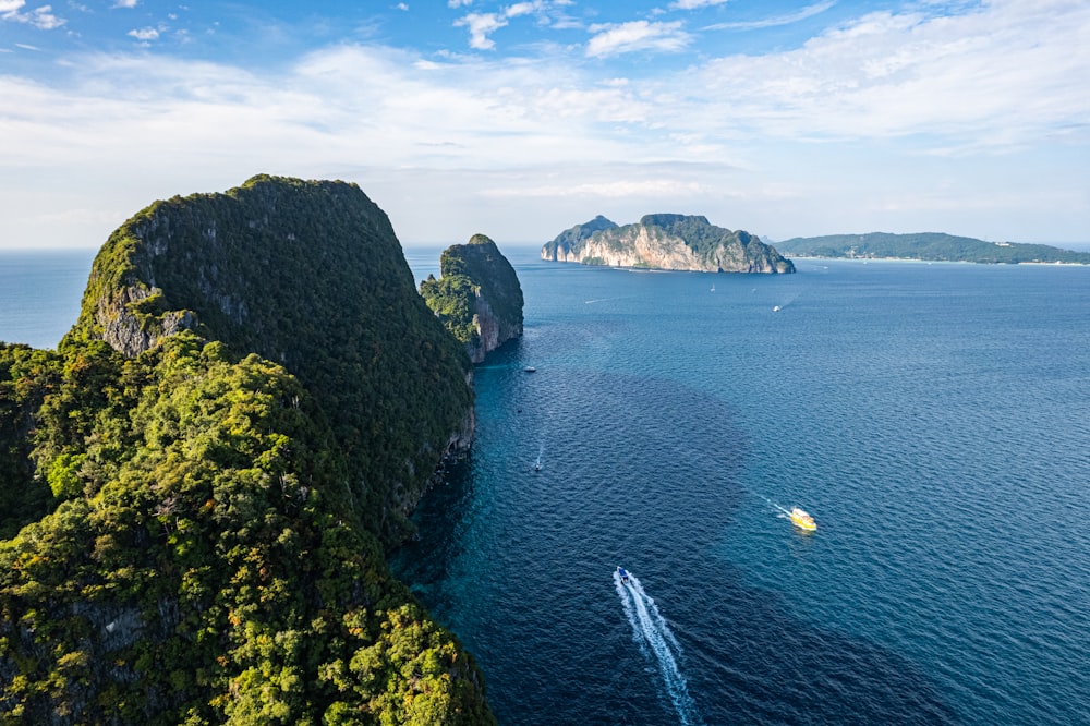 an aerial view of a boat in the ocean