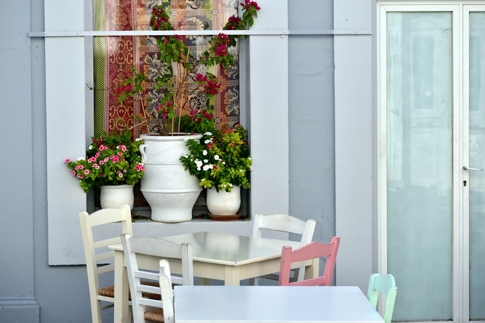 a table and chairs outside of a building